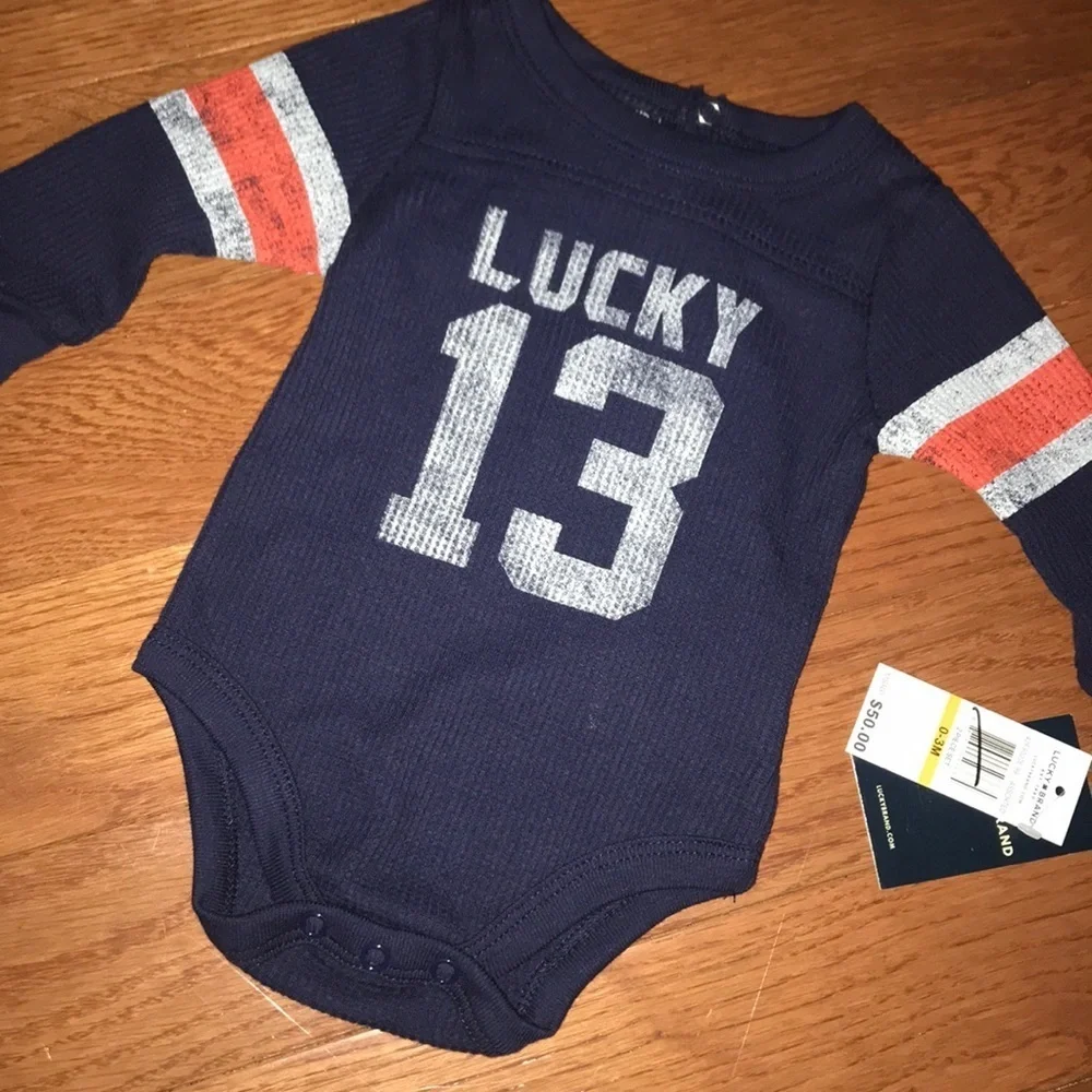 NWT Lucky Brand onesie 0-3 months